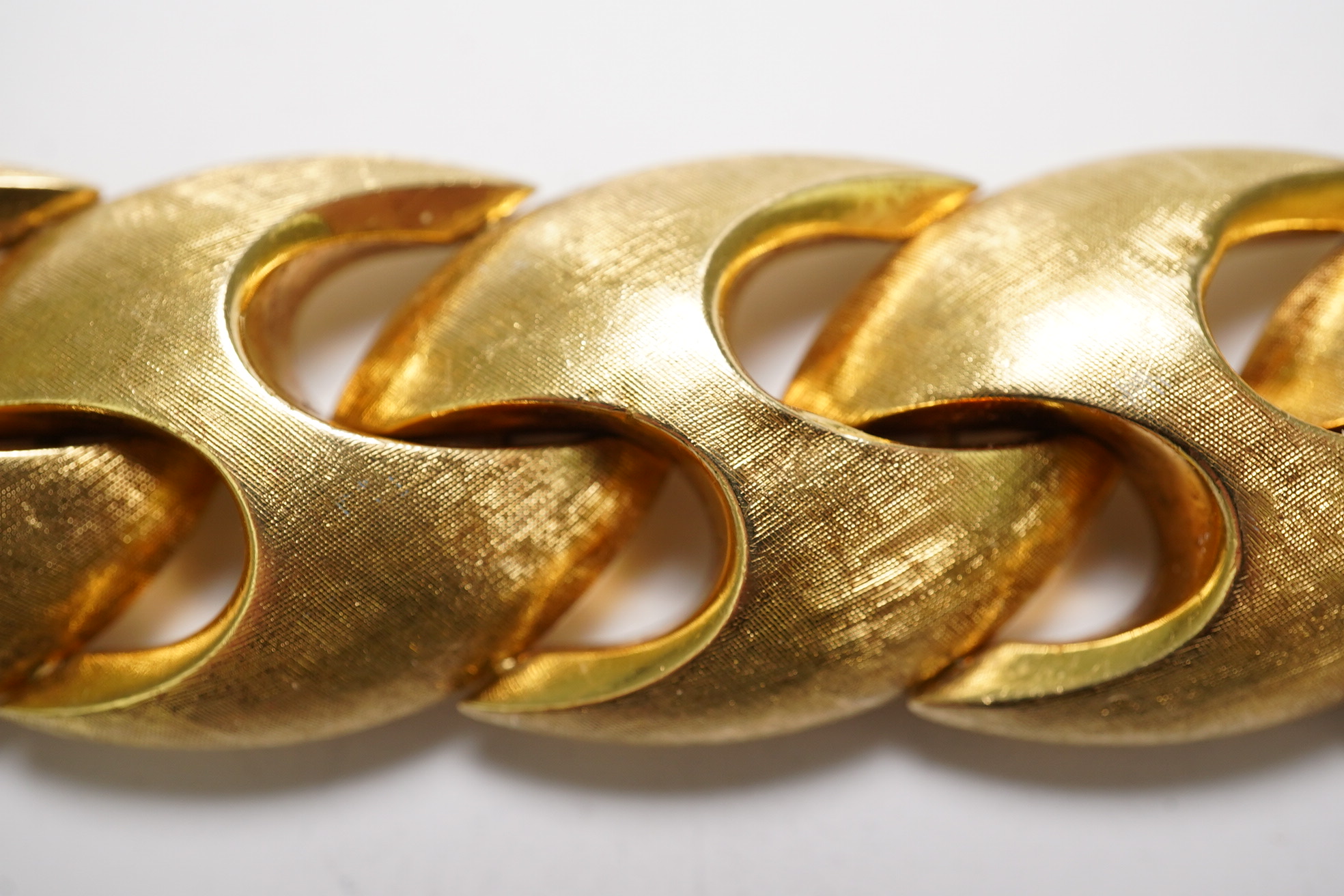 A stylish early 1970's brushed 18ct gold bracelet